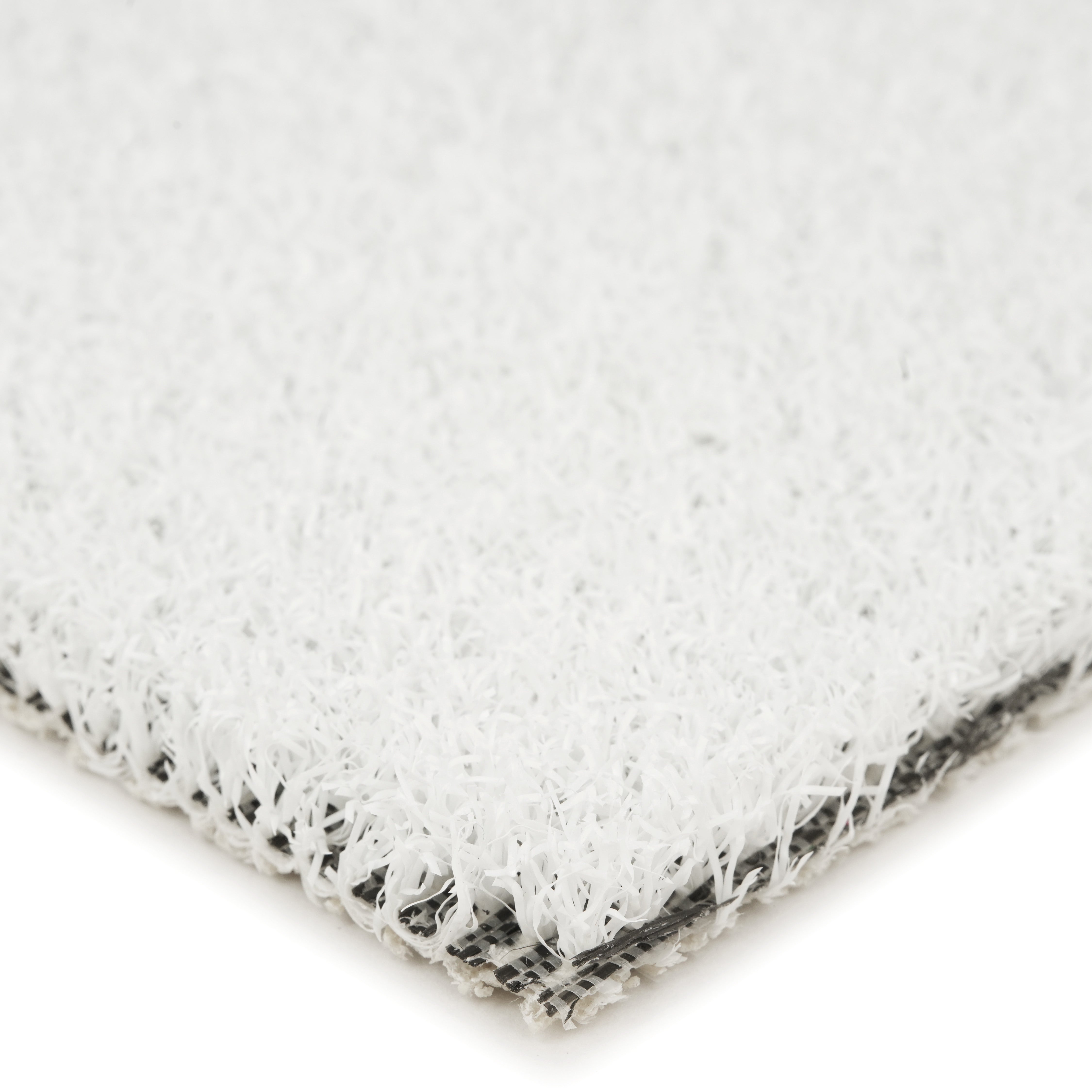 Close-up of a white synthetic turf material, ideal for outdoor spaces and landscaping.